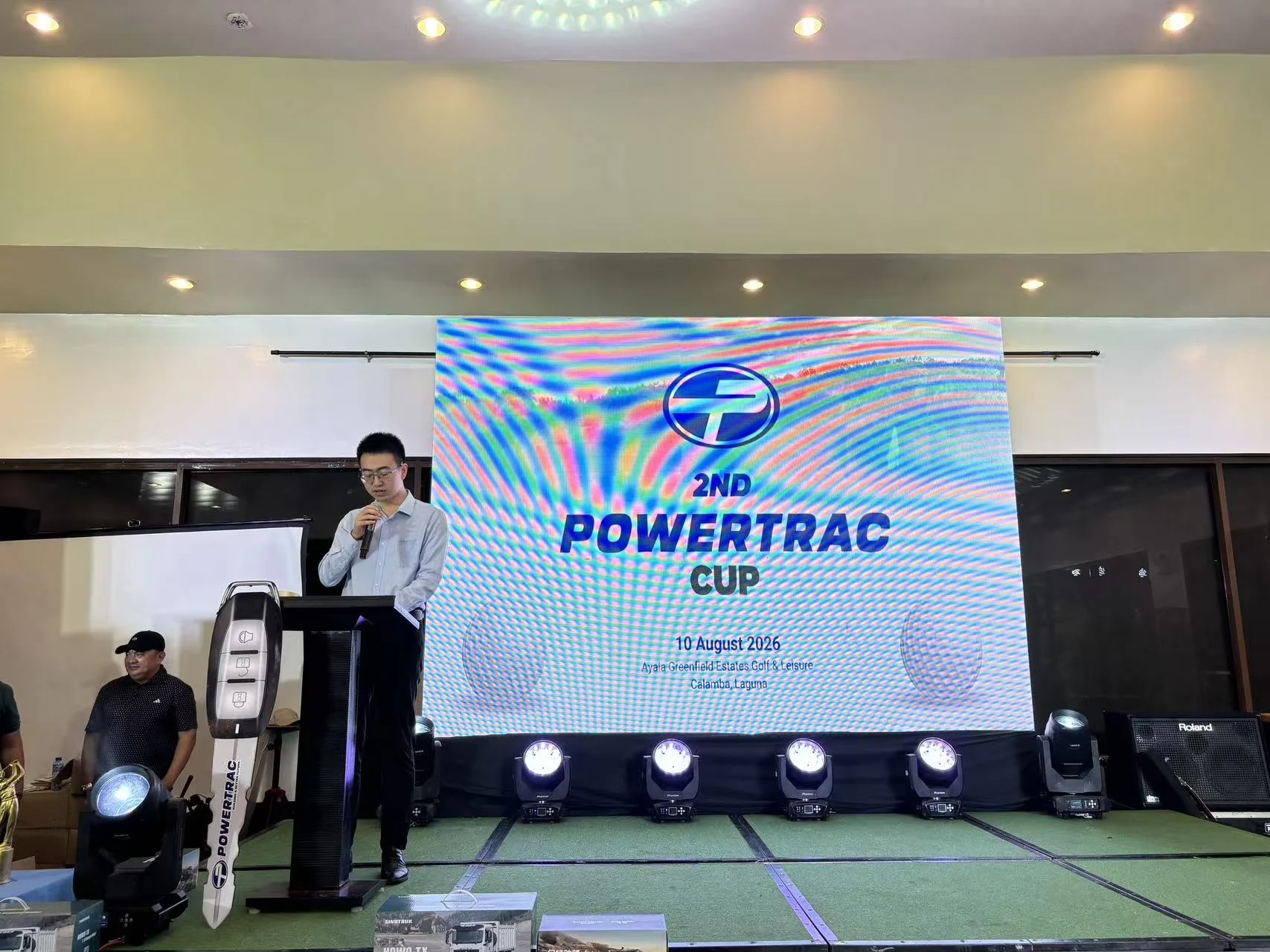 Speaker addressing guests at the 2nd Powertrac Cup
