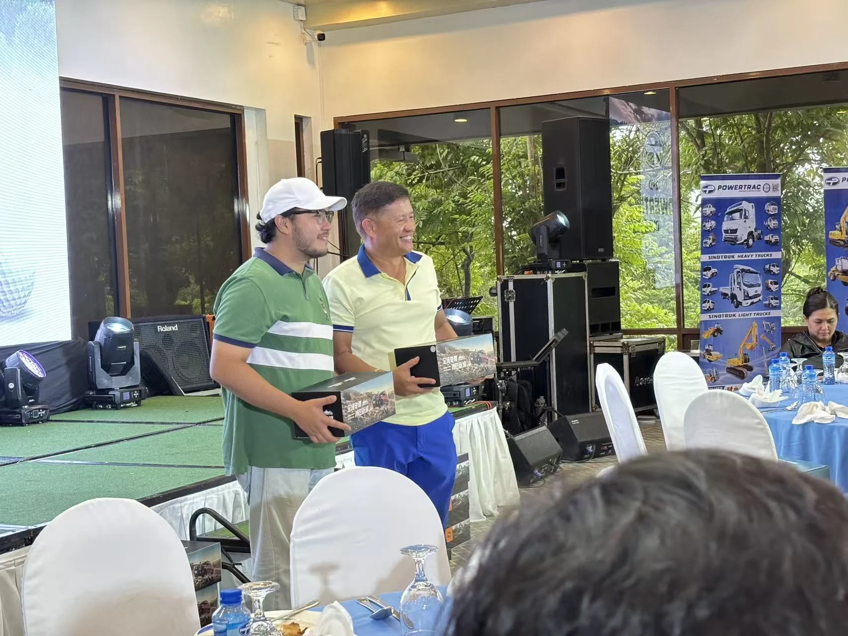 Presentation of a miniature truck prize at the Powertrac Cup